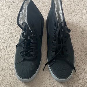 Nike high top tennis shoes.